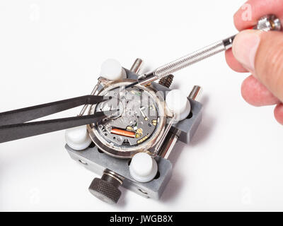 watchmaker workshop - replacement battery in quartz watch close up on white background Stock Photo