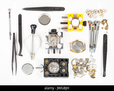 watchmaker workshop - top view of watch repairing tools on white background Stock Photo