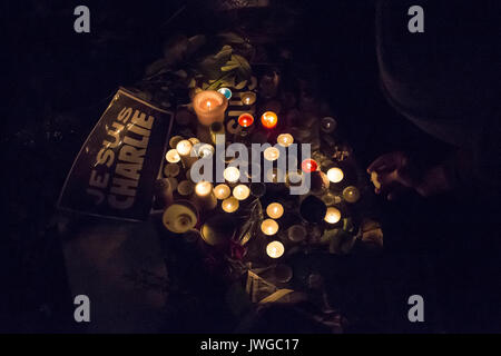 je suis charlie sign among candles. Homage at the victims of Charlie hebdo killing in Paris the 7th of january 2015. Stock Photo