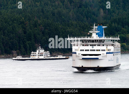 The BC Ferries Car Ferries Mayne Queen and Spirit of Vancouver Island Passing Each Other in the Strait of Georgia Off Vancouver BC Canada Stock Photo