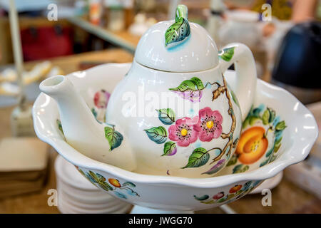 Beautiful delft teapot with flower painting Stock Photo