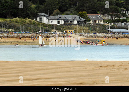 the black tor ferry on the beach on the camel river estuary In Rock near to Padstow on the North Cornish coast. passenger ferry across the river camel Stock Photo