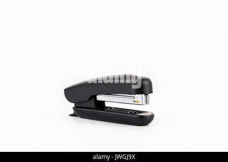 Black stapler isolated on white. Business and education background Stock Photo