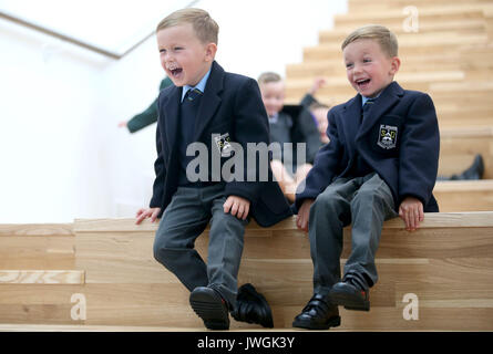 Reilly (left) and Harry Small join 13 sets of twins for a photocall as they start primary school in the Inverclyde area at St Patrick's Primary School in Greenock. Stock Photo