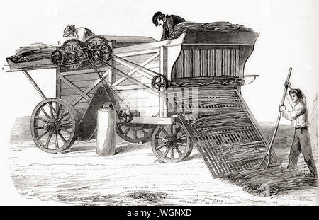 A 19th century threshing machine.  From Les Merveilles de la Science, published 1870. Stock Photo