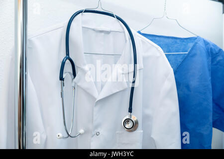 medical occupation uniforms on hanger Stock Photo