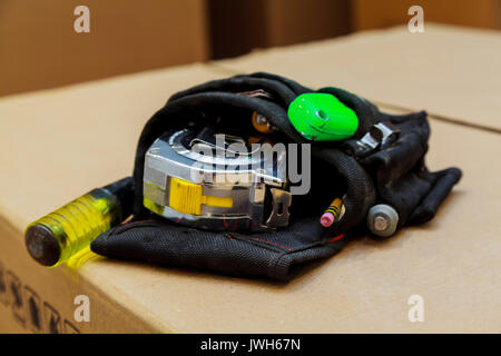 Tool bag set of tools in a bag on wooden background Stock Photo