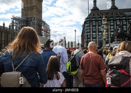 London, UK 12th August 2017. Crowds of tourists on Westminster Bridge on a overcast but warm day with tempertures 22 degrees.:Credit: Claire Doherty Alamy/Live News Stock Photo