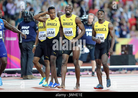 London, UK. 12th August, 2017. An injured Usain Bolt helped by the rest of the Jamaican relay team in the Men's 4 x 100m Final at the 2017 IAAF World Championships, Queen Elizabeth Olympic Park, Stratford, London, UK. Credit: Simon Balson/Alamy Live News Stock Photo