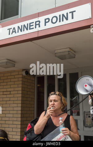 London, UK. 12th August 2017. Housing campaigner Nanacy Taffe speaks outside Tanner Point in Plaistow, another Newham Council tower block with the same unsafe cladding as Grenfell Tower,. The march organised by Focus E15 Mothers demanded safe homes, not social cleansing in East London.  From Tanner Point they continued to the Carpenters Estate in Stratford largely emptied of people over 10 years ago and intends to demolish, for a ‘hands around the Carpenters Estate’ solidarity event against decanting, demolition and Credit: Peter Marshall/Alamy Live News Stock Photo
