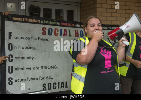 London, UK. 12th August 2017. Jasmin Stone of Focus E15 Mothers speaks outside Tanner Point in Plaistow, another Newham Council tower block with the same unsafe cladding as Grenfell Tower,. The march organised by Focus E15 Mothers demanded safe homes, not social cleansing in East London.  From Tanner Point they continued to the Carpenters Estate in Stratford largely emptied of people over 10 years ago and intends to demolish, for a ‘hands around the Carpenters Estate’ solidarity event against decanting, demolition a Credit: Peter Marshall/Alamy Live News Stock Photo
