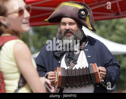 Vancouver, Canada. 12th Aug, 2017. A costumed actor performs music during the 14th Richmond Maritime Festival in Richmond, Canada, on Aug. 12, 2017. The 14th Richmond Maritime Festival showcased maritime-themed activities and exhibitions to introduce Canada's maritime history and culture. Credit: Liang Sen/Xinhua/Alamy Live News Stock Photo
