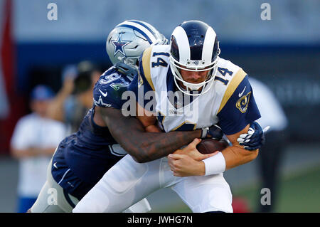 Los Angeles, CA, USA. 12th Aug, 2017.  Los Angeles Rams quarterback Sean Mannion is sacked by Dallas Cowboys Taco Charlton in the first quarter at the Los Angeles Memorial Coliseum. Credit: K.C. Alfred/San Diego Union-Tribune/ZUMA Wire/Alamy Live News Stock Photo