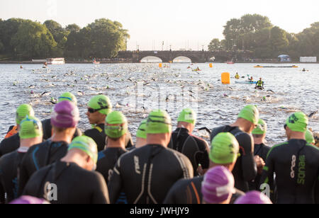 Hamburg, Germany. 13th Aug, 2017. Ironman competitors prepare for the swimming event in the Inner Alster Lake in Hamburg, Germany, 13 August 2017. Around 2500 athletes will swim 3.8 kilometres in the Alster, cycle 180 kilometres through Lower Saxony and Hamburg and run a 42 kilometre marathon round the Alster lakes. Photo: Daniel Bockwoldt/dpa/Alamy Live News Stock Photo
