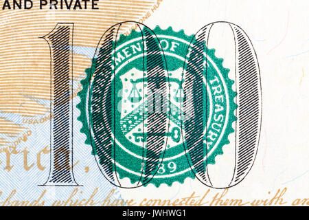 Number 100 on 100 dollar bill in macro. Stock Photo