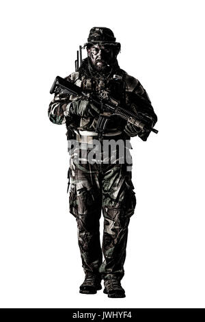 Special forces United States in Camouflage Uniforms studio shot. Holding weapons, wearing jungle hat, Shemagh scarf, painted face, his outfit clothes  Stock Photo