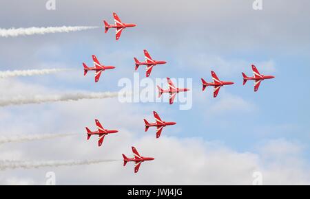 The Red Arrows flying in the Concorde formation Stock Photo