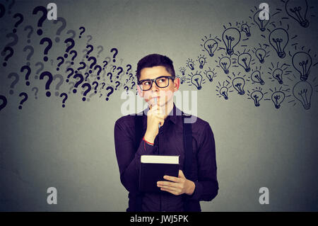 Man finding answers to many questions generating ideas Stock Photo