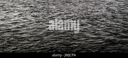 Abstract dark water surface. Dark grunge water background. Nature background. Gloomy background Stock Photo