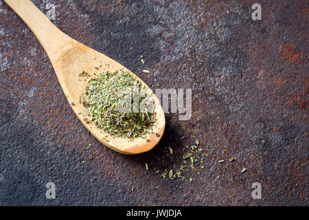 Mixed Italian Herbs Seasoning on rustic metal background, copy space. Dried Herbs Seasoning, healthy ingredient for cooking. Stock Photo