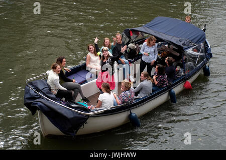 A boat carrying a hen party sails on a canal in Utrecht, the Netherlands, August 5, 2017. © John Voos Stock Photo