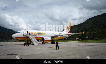 Thimphu, Bhutan - Sep 4, 2015. People with aircraft at Paro Airport in Thimphu, Bhutan. Thimphu is the capital and largest and only city of the Kingdo Stock Photo