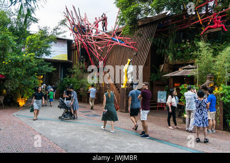 Visitors strolling OCT LOFT in Shenzhen, Guangdong province, China, in front of modern art themed restaurant