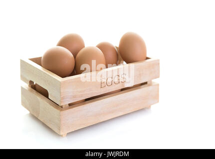 Wooden Egg Box on a white background Stock Photo