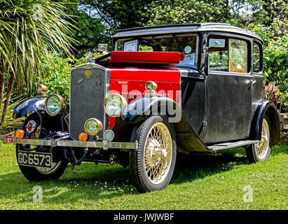 Low-angle, front three quarter view of the 1929 Swift Foursome Coupe on display in a garden setting Stock Photo