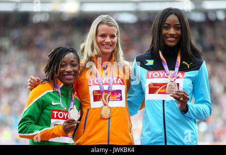 Netherland's Dafne Schippers (centre) celebrates with the gold medal, Ivory Coast's Marie-Josee Ta Lou (left) with the silver and Bahamas' Shaunae Miller-Uibo with the bronze on the podium for the Womens 200m Final during day nine of the 2017 IAAF World Championships at the London Stadium. Stock Photo