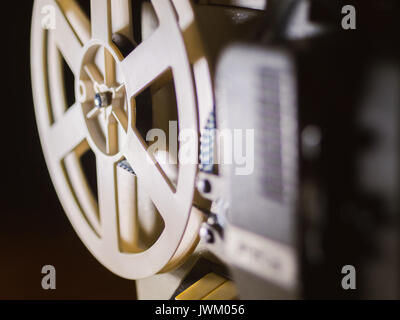 film projector on a black background with dramatic lighting and selective focus Stock Photo