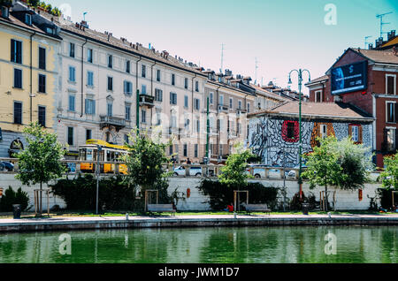 A traditional 1930s tram in Milan, Italy taken at Bohemian Navigli district Stock Photo