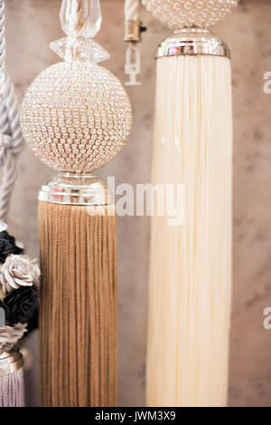Beautiful curtains accessory. Close up of tassels for curtain Stock Photo