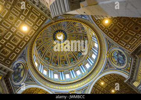 The Cupola of St Peters Basilica in Vatican City, Rome Italy from the interior showing brilliant gold and blue colors Stock Photo