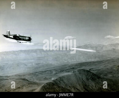 U.S. Navy Vought F4U Corsair fighter aircraft fires a 6.5-inch Anti-Tank Aircraft Rocket known as an ATAR during a combat mission over Korea during the Korean War in 1951. Stock Photo