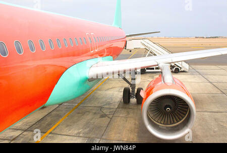 Airplane being preparing ready for takeoff in international airport Stock Photo