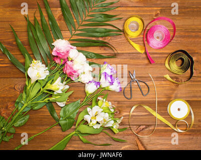 The florist desktop with working tools on wooden background Stock Photo