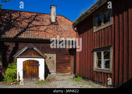 Traditional red wooden dwelling and farm in Skansen museum. Sweden Stock Photo