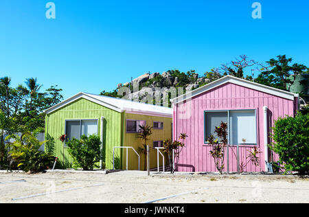 Row of pastel coloured cabins, Horseshoe Bay, Bowen, Queensland, QLD, Australia Stock Photo