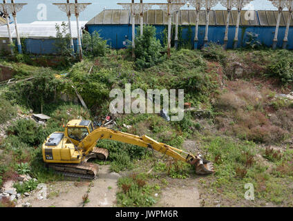 Elevated view of Komatsu pc 130 hydraulic excavator on the site of the Llandudno pier pavillion in conwy north wales uk Stock Photo