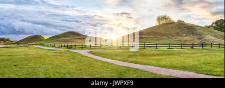 Panorama of Royal Mounds on sunset in Gamla Uppsala, Uppland, Sweden Stock Photo