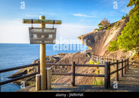 Kumano, Japan coast line at Onigajo 'Devil's Castle' rocks on the coastline. (Sign reads: 'Yoshino-Kumano National Park, Onigajo, Mie Prefecture') Stock Photo