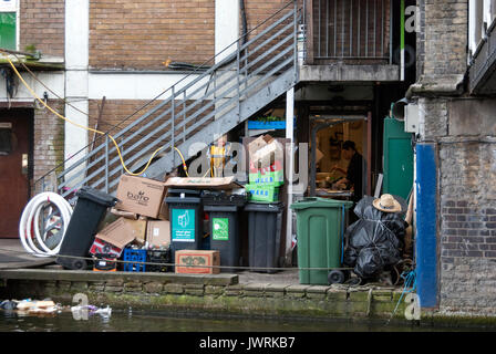 London England, Camden Lock, Rubbish at Back Door of Kitchen Entrance, Person Cooking with Kitchen Door Open, Rubbish in Lake, Bins Full, Market Area Stock Photo