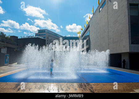 Playing in fountains on London's South Bank embankment Stock Photo