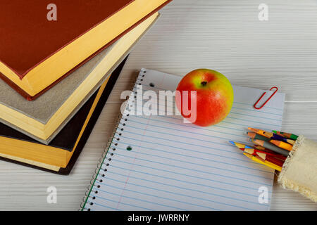 notebook with pencils, calculator and various school or office supplies. School notebooks pencils scissors Stock Photo