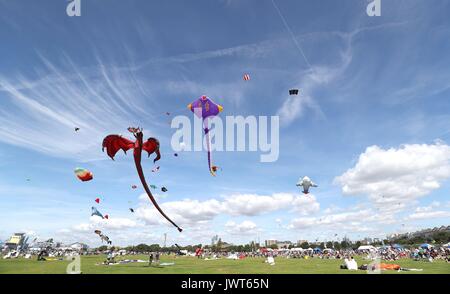 Kites are flown over Southsea Common during the 2017 Portsmouth Kite Festival in Southsea, Hampshire. Stock Photo