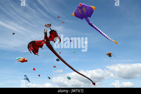 Kites are flown over Southsea Common during the 2017 Portsmouth Kite Festival in Southsea, Hampshire. Stock Photo