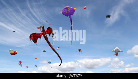 Kites are flown over Southsea Common during the 2017 Portsmouth Kite Festival in Southsea, Hampshire. Stock Photo