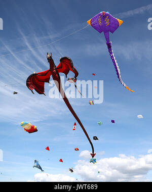 Kites are flown over Southsea Common during the 2017 Portsmouth Kite Festival in Southsea, Hampshire. Stock Photo