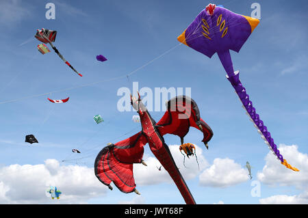 Kites are flown over Southsea Common during the 2017 Portsmouth Kite Festival in Southsea, Hampshire. Stock Photo